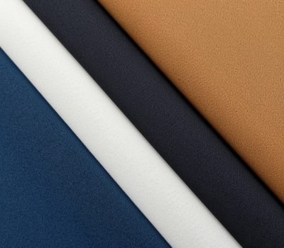 lucid-origin_Close-up_of_folded_fabrics_in_different_colors_and_textures_including_cotton_sil-0